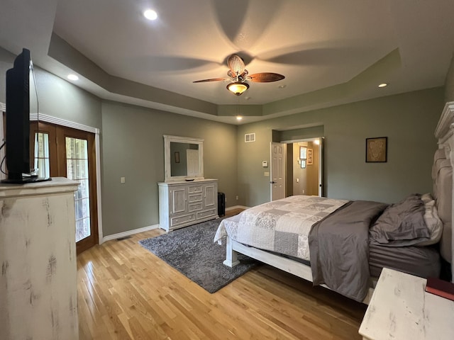 7876 County Road 3400, Mountain View, MO 65548 - bedroom with a tray ceiling, light wood-style floors, recessed lighting, and ceiling fan