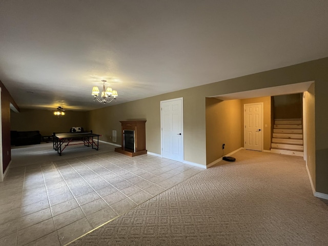 7876 County Road 3400, Mountain View, MO 65548 - rec room with a fireplace with raised hearth, a chandelier, and light carpet