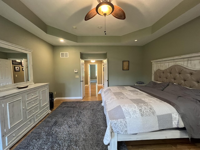 7876 County Road 3400, Mountain View, MO 65548 - bedroom featuring wood finished floors, a raised ceiling, recessed lighting, and a ceiling fan