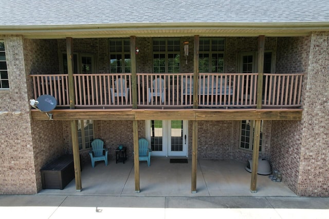 7876 County Road 3400, Mountain View, MO 65548 - back of property with brick siding, a patio, and roof with shingles