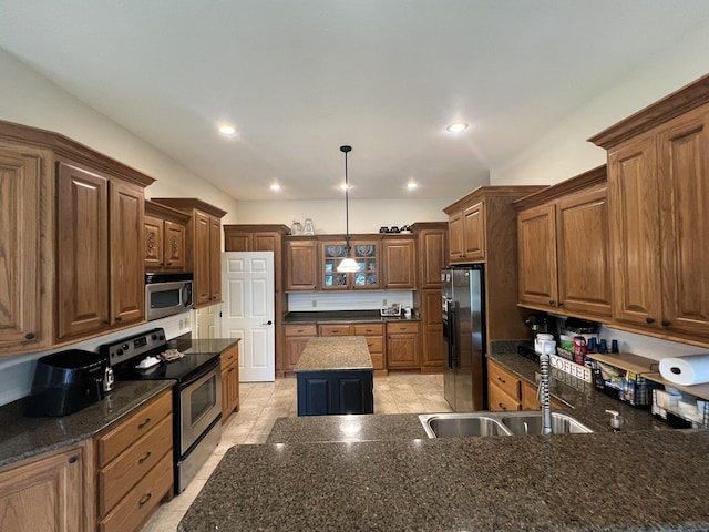 7876 County Road 3400, Mountain View, MO 65548 - kitchen featuring appliances with stainless steel finishes, a kitchen island, hanging light fixtures, brown cabinetry, and recessed lighting