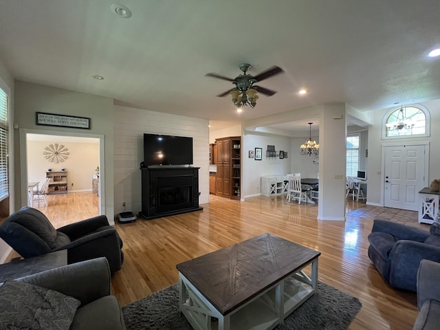 7876 County Road 3400, Mountain View, MO 65548 - living room featuring a chandelier, plenty of natural light, a fireplace, light wood finished floors, and recessed lighting