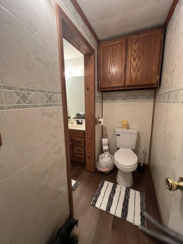 2039 US Highway 65, Buffalo, MO 65622 - bathroom featuring tile walls, vanity, and wood finished floors