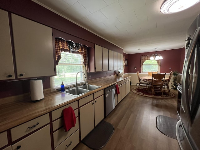 2039 US Highway 65, Buffalo, MO 65622 - kitchen with stainless steel appliances, dark wood-style floors, healthy amount of natural light, crown molding, and a chandelier