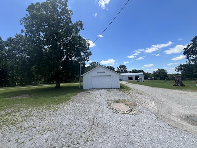 2039 US Highway 65, Buffalo, MO 65622 - detached garage featuring asphalt driveway