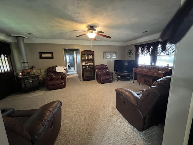2039 US Highway 65, Buffalo, MO 65622 - carpeted living area featuring a wood stove and a ceiling fan