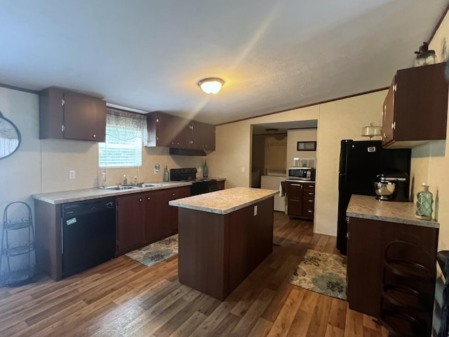 2039 US Highway 65, Buffalo, MO 65622 - kitchen featuring black appliances, light countertops, a kitchen island, and dark wood-style flooring