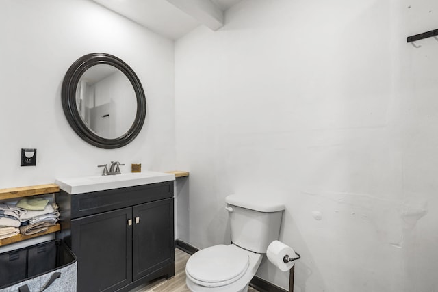 3430 S Elmview Ave, Springfield, MO 65804 - half bathroom with vanity, wood finished floors, and beam ceiling