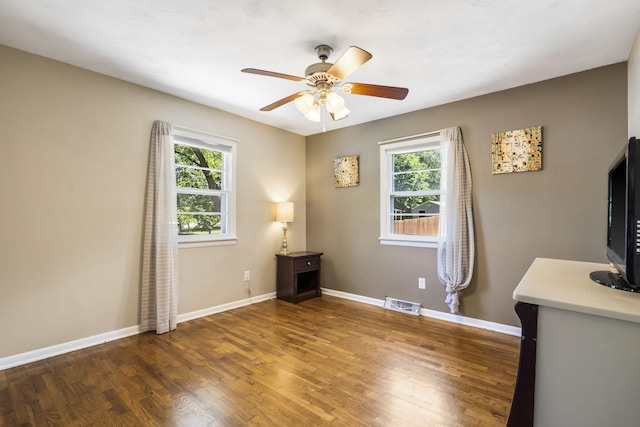 3430 S Elmview Ave, Springfield, MO 65804 - spare room with healthy amount of natural light, wood finished floors, and a ceiling fan