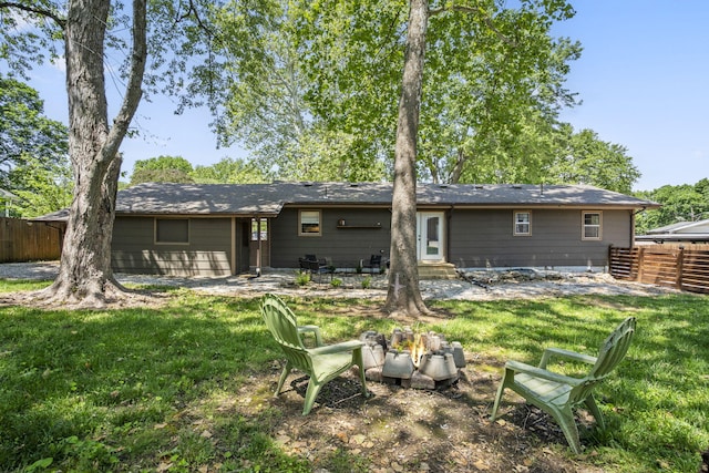 3430 S Elmview Ave, Springfield, MO 65804 - rear view of house with entry steps and an outdoor fire pit