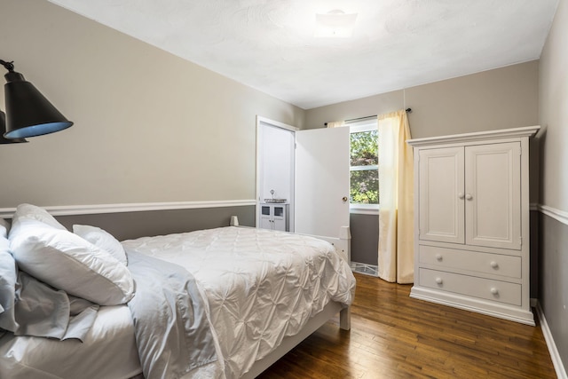 3430 S Elmview Ave, Springfield, MO 65804 - bedroom with dark wood-style floors and baseboards