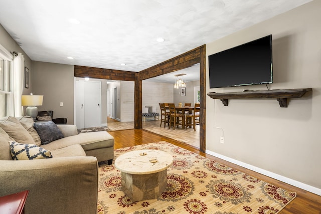 3430 S Elmview Ave, Springfield, MO 65804 - living room with wood finished floors, recessed lighting, and a chandelier