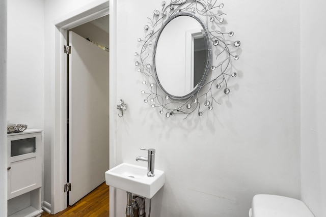 3430 S Elmview Ave, Springfield, MO 65804 - half bathroom with toilet and wood finished floors