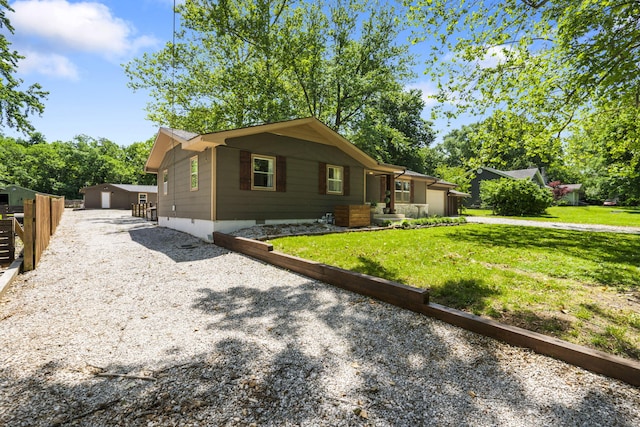 3430 S Elmview Ave, Springfield, MO 65804 - view of front of property featuring a front lawn, driveway, and an outdoor structure