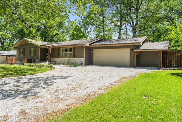 3430 S Elmview Ave, Springfield, MO 65804 - ranch-style house featuring gravel driveway, a garage, and brick siding
