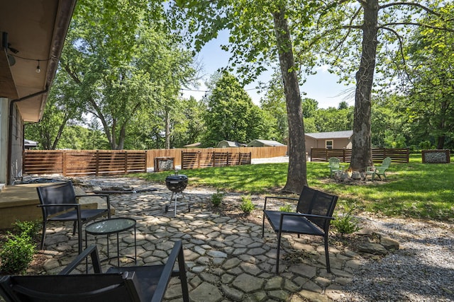 3430 S Elmview Ave, Springfield, MO 65804 - fenced backyard with a patio, an outdoor fire pit, and view of scattered trees