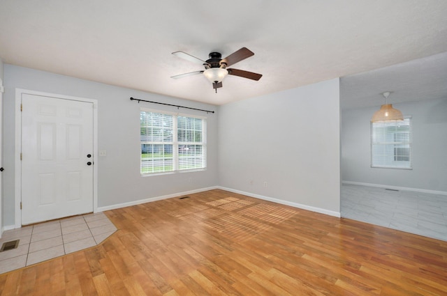 1037 N Clifton Ave, Springfield, MO 65802 - entryway featuring ceiling fan, light wood-style floors, and plenty of natural light