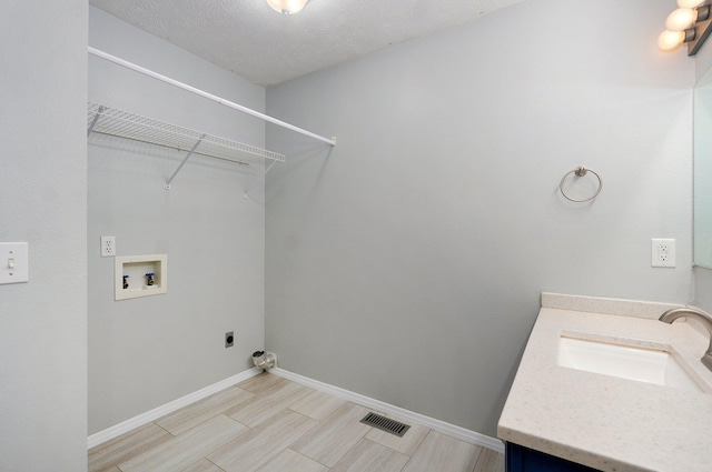 1037 N Clifton Ave, Springfield, MO 65802 - washroom featuring electric dryer hookup, hookup for a washing machine, and light wood-style flooring