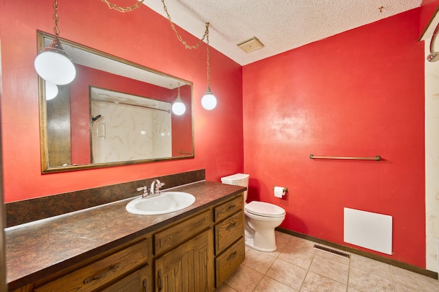 5751 S Kings Ave, Springfield, MO 65810 - bathroom with vanity, a textured ceiling, and tile patterned flooring