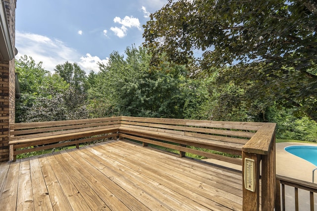5751 S Kings Ave, Springfield, MO 65810 - wooden deck featuring an outdoor pool and view of wooded area