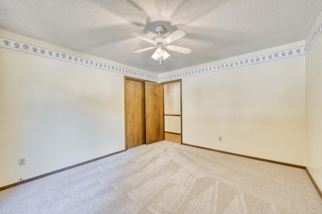 5751 S Kings Ave, Springfield, MO 65810 - empty room with light colored carpet, a ceiling fan, and a textured ceiling
