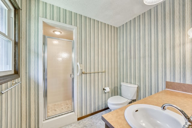 5751 S Kings Ave, Springfield, MO 65810 - bathroom with a shower stall, tile patterned floors, and a textured ceiling