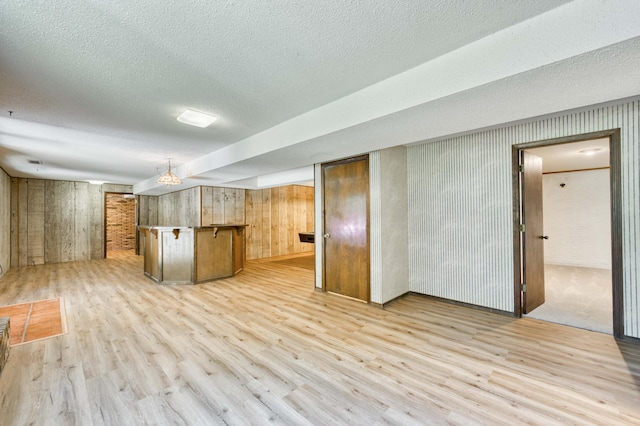 5751 S Kings Ave, Springfield, MO 65810 - kitchen with light wood-style flooring and a textured ceiling