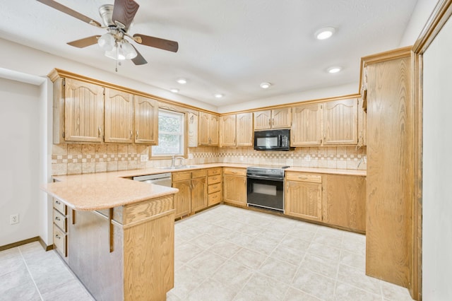 5751 S Kings Ave, Springfield, MO 65810 - kitchen with black appliances, a peninsula, light countertops, backsplash, and recessed lighting