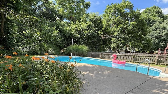 5751 S Kings Ave, Springfield, MO 65810 - view of swimming pool featuring a patio and view of wooded area