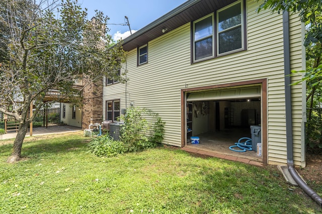 5751 S Kings Ave, Springfield, MO 65810 - view of home's exterior with a yard and an attached garage