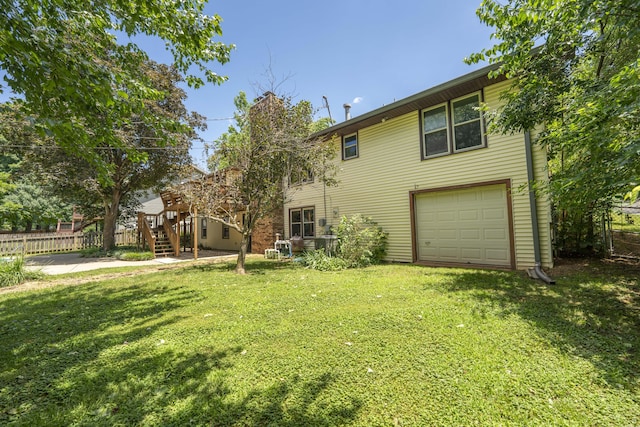 5751 S Kings Ave, Springfield, MO 65810 - rear view of property featuring a garage and stairs