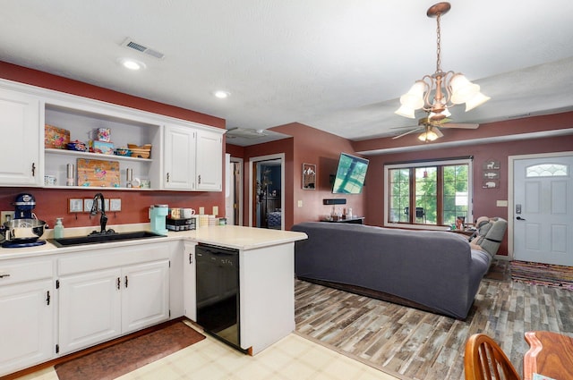 1360 Johnson Rd, Sparta, MO 65753 - kitchen featuring dishwasher, a chandelier, open floor plan, white cabinetry, and recessed lighting