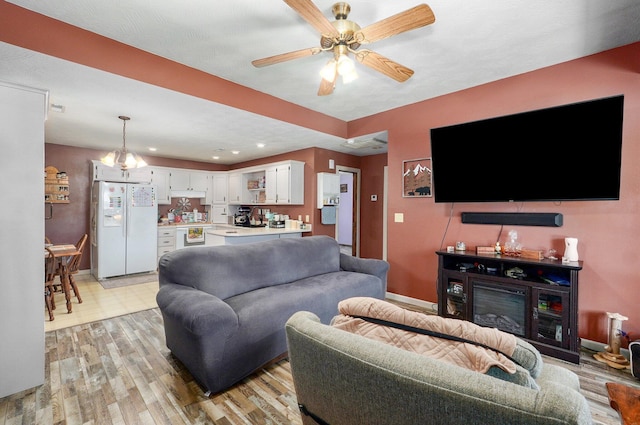 1360 Johnson Rd, Sparta, MO 65753 - living area with light wood-style flooring, a ceiling fan, and recessed lighting