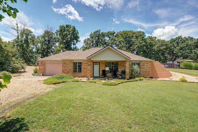 1360 Johnson Rd, Sparta, MO 65753 - single story home with driveway, an attached garage, brick siding, and a front yard
