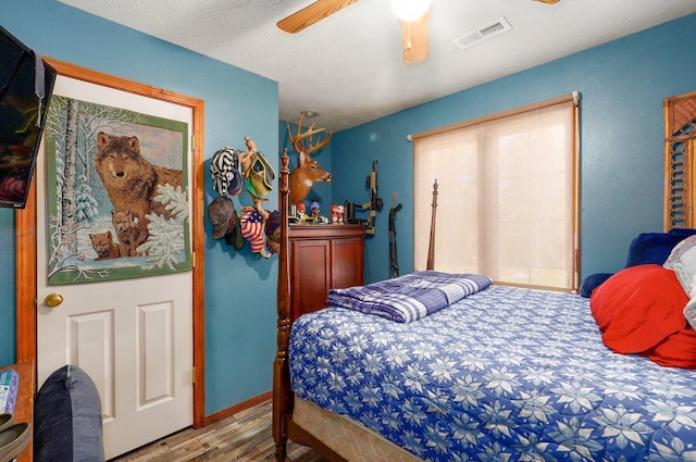 1360 Johnson Rd, Sparta, MO 65753 - bedroom featuring wood finished floors and a ceiling fan