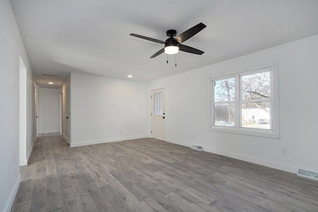 502 S Walnut St, Walnut Grove, MO 65770 - spare room with wood finished floors, ceiling fan, and recessed lighting