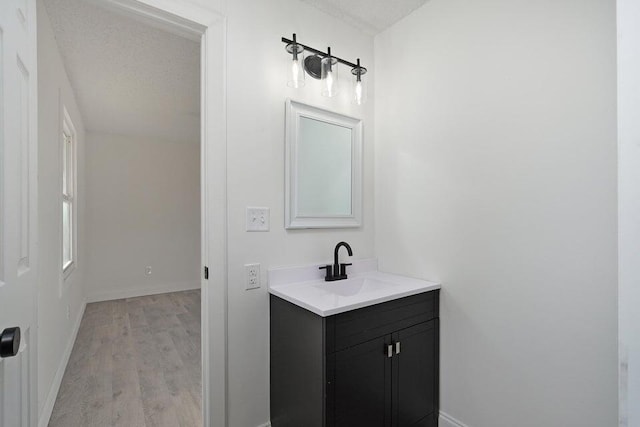502 S Walnut St, Walnut Grove, MO 65770 - bathroom featuring vanity and wood finished floors
