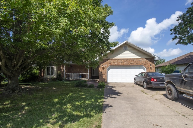 301 N Gregg Rd, Nixa, MO 65714 - view of front of house featuring a garage, brick siding, driveway, a front yard, and covered porch