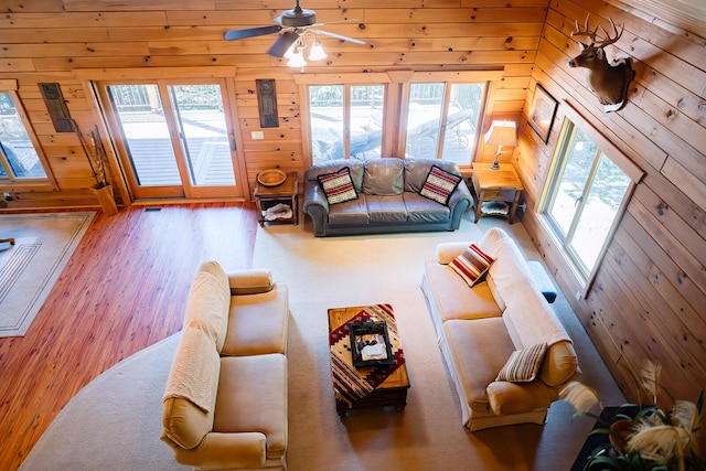 20816 Valley View Trl, Wheatland, MO 65779 - living room with wood finished floors, a ceiling fan, and wooden walls