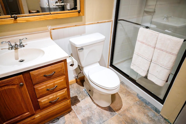20816 Valley View Trl, Wheatland, MO 65779 - bathroom with vanity, a shower stall, stone finish floors, and a wainscoted wall