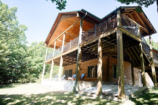 20816 Valley View Trl, Wheatland, MO 65779 - rear view of house featuring a wooden deck, a patio, and faux log siding