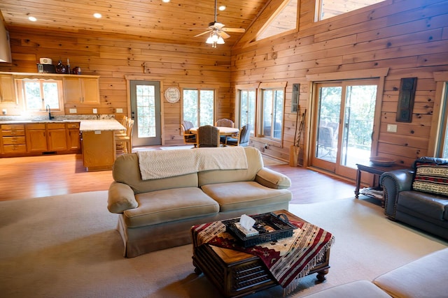 20816 Valley View Trl, Wheatland, MO 65779 - living room featuring lofted ceiling, wood ceiling, recessed lighting, ceiling fan, and wood walls