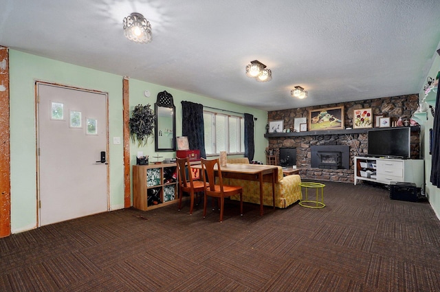 528 N Locust St, Marshfield, MO 65706 - living area featuring carpet, a fireplace, and a textured ceiling