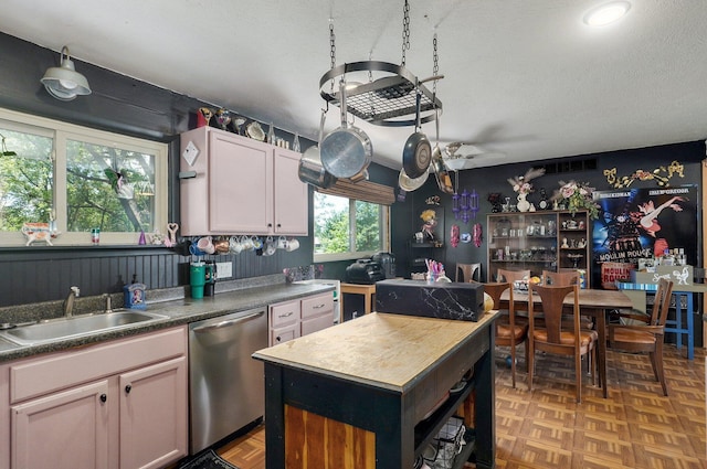 528 N Locust St, Marshfield, MO 65706 - kitchen with dishwasher, a textured ceiling, dark countertops, and white cabinetry