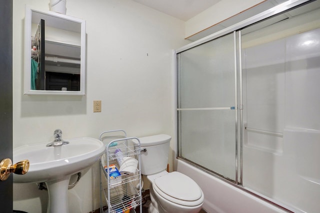 528 N Locust St, Marshfield, MO 65706 - full bathroom featuring toilet and bath / shower combo with glass door