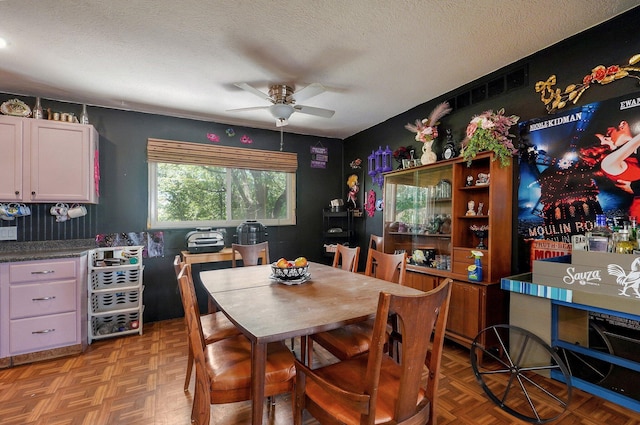 528 N Locust St, Marshfield, MO 65706 - dining room featuring ceiling fan and a textured ceiling