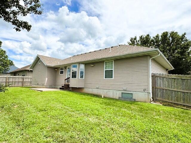 1359 W Stone House Rd, Nixa, MO 65714 - rear view of house with entry steps and a patio area