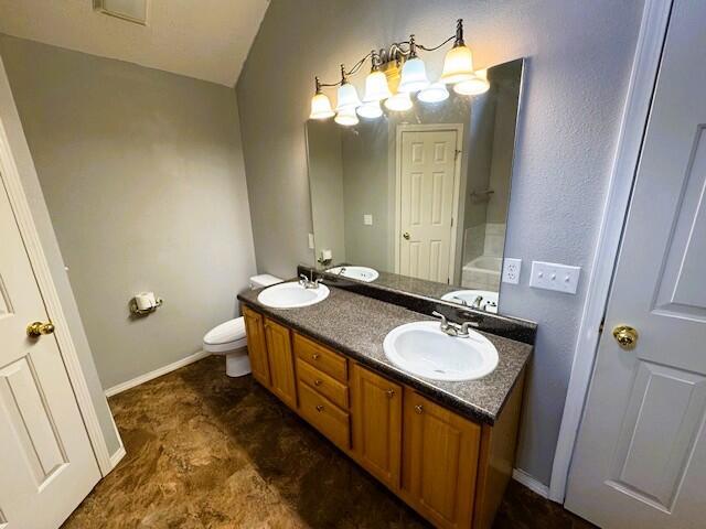 1359 W Stone House Rd, Nixa, MO 65714 - bathroom with double vanity and lofted ceiling