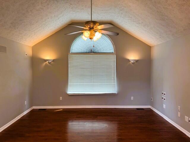 1359 W Stone House Rd, Nixa, MO 65714 - spare room with ceiling fan, a textured ceiling, wood finished floors, and lofted ceiling