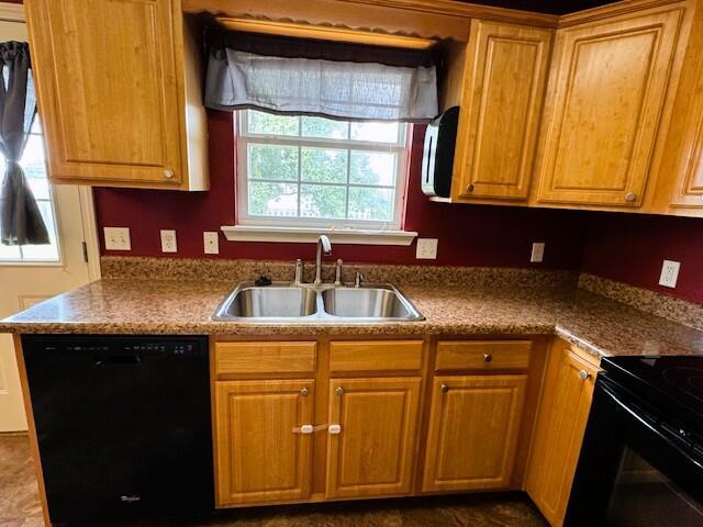 1359 W Stone House Rd, Nixa, MO 65714 - kitchen with black appliances and brown cabinetry